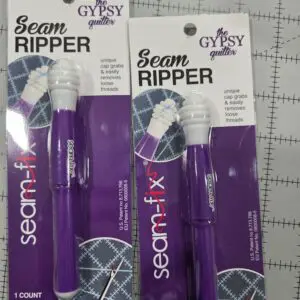 Various purple Seam Ripper tools in packaging from different brands.
