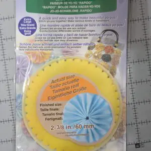 A yellow circular craft tool for making paper rosettes with instructional text.