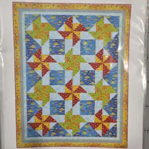 A colorful patchwork quilt with star and geometric patterns.
